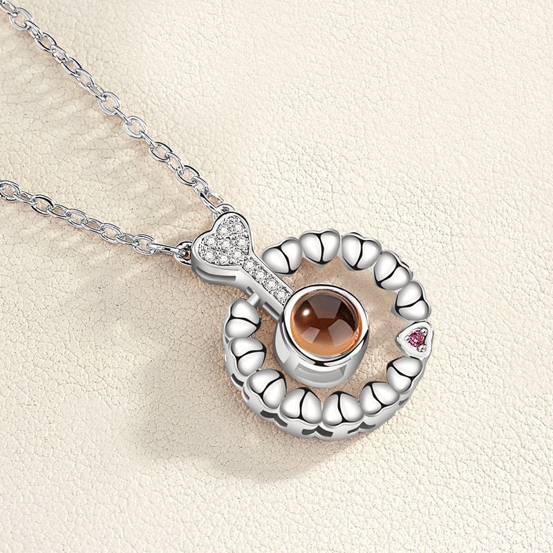 I love you 100 languages love memory projection necklace - StyleSanity